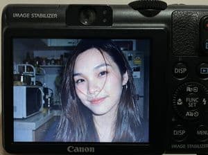 Compact Digital Camera Screen Snapshot of a Young Woman
